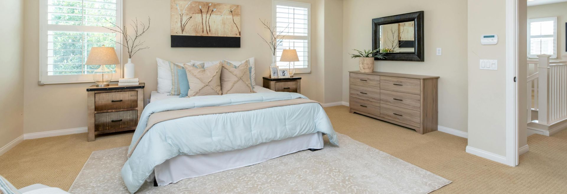 Bright modern bedroom with neutral decor and cozy ambiance, perfect for home decor inspiration.
